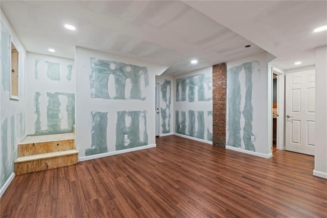 unfurnished living room featuring wood-type flooring