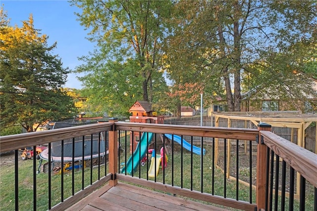 wooden terrace featuring a playground