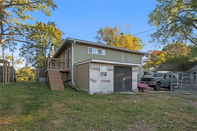 exterior space featuring a lawn and a deck