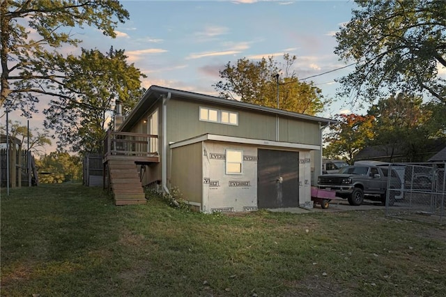 back house at dusk with a yard