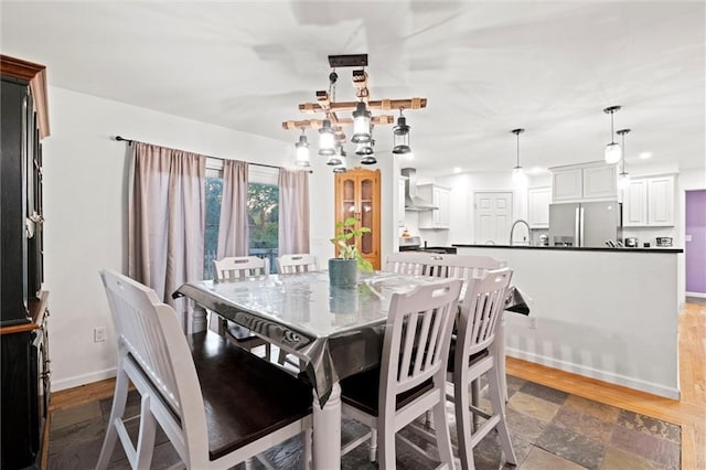 dining space featuring dark wood-type flooring