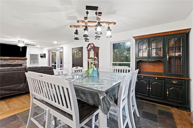 dining space featuring dark wood-type flooring and ceiling fan