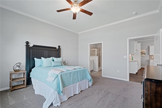 bedroom featuring ceiling fan, ornamental molding, carpet flooring, and connected bathroom