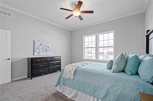 carpeted bedroom featuring crown molding and ceiling fan