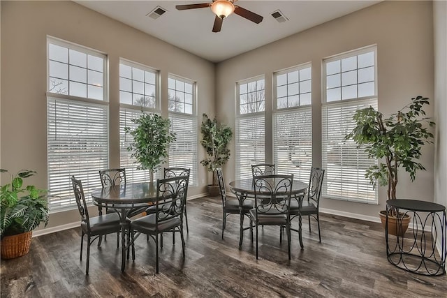 dining room with a healthy amount of sunlight, dark hardwood / wood-style floors, and ceiling fan