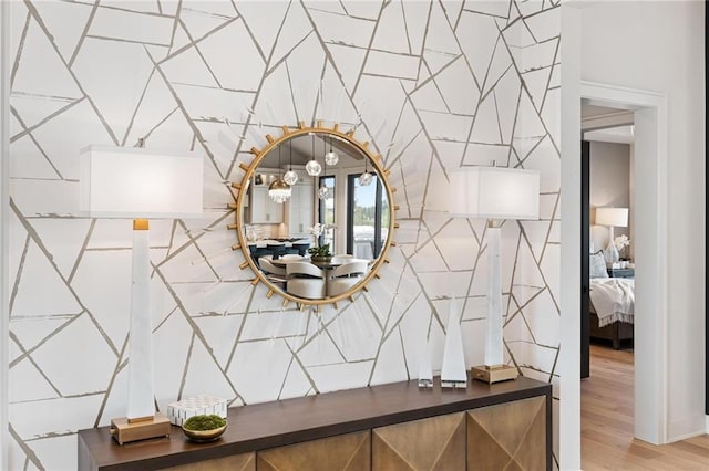 room details featuring wood finished floors and a notable chandelier