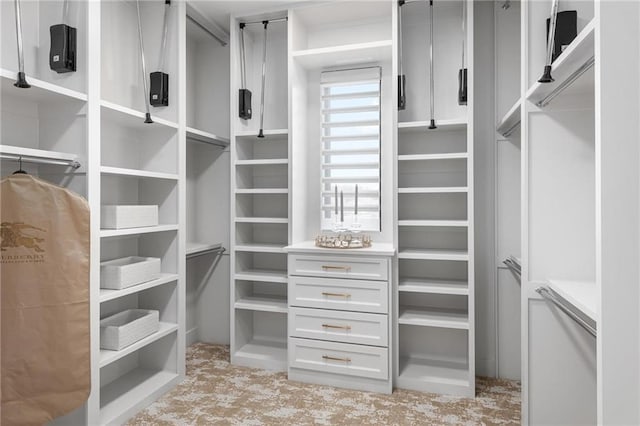 spacious closet with light tile patterned floors