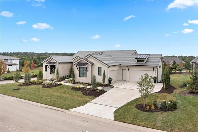 view of front facade with an attached garage, driveway, a tiled roof, stucco siding, and a front lawn