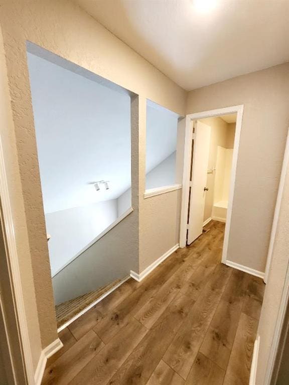 corridor featuring hardwood / wood-style flooring