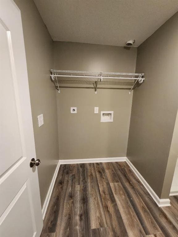 washroom with washer hookup, hookup for an electric dryer, a textured ceiling, and dark wood-type flooring