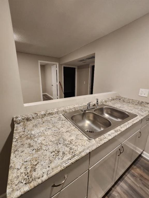 interior space with vanity and hardwood / wood-style flooring