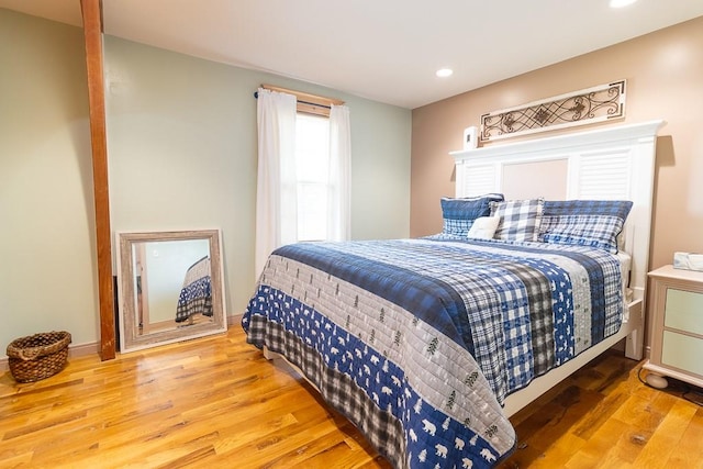 bedroom with wood-type flooring