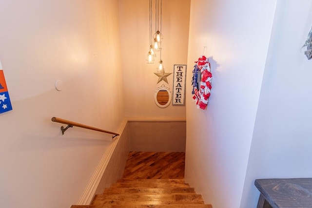 staircase featuring hardwood / wood-style flooring