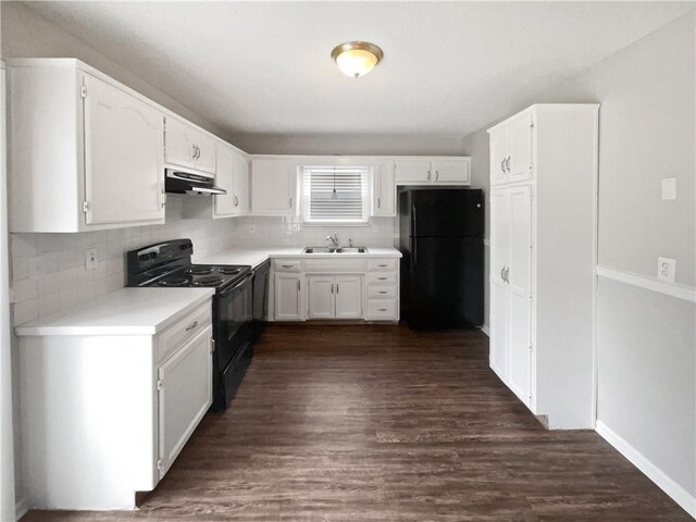 kitchen with black appliances, dark hardwood / wood-style floors, sink, and white cabinets