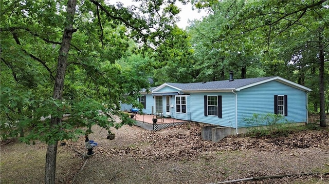 view of front facade with a wooden deck