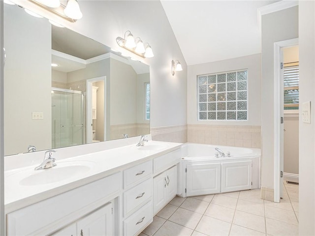 bathroom with a stall shower, lofted ceiling, a sink, and tile patterned floors