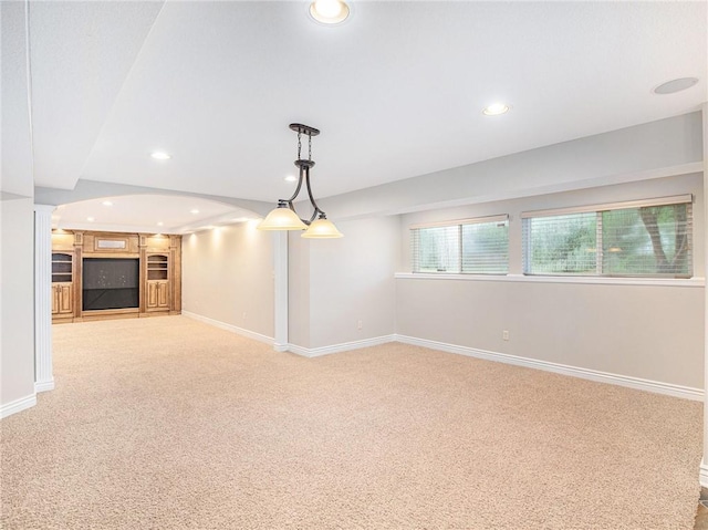 unfurnished living room featuring light carpet, recessed lighting, and baseboards