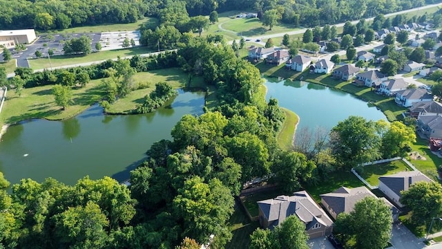 drone / aerial view featuring a water view and a residential view