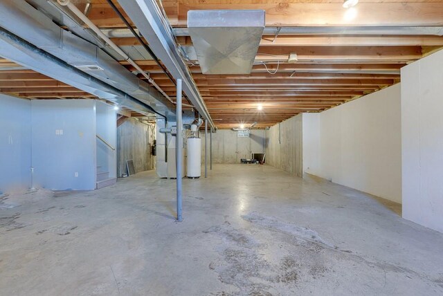 unfinished basement with water heater