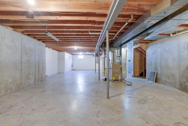 unfinished below grade area featuring heating unit