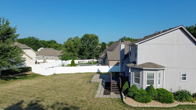 view of yard with fence and a residential view