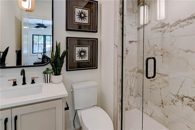 2207 W 71st St, Prairie Village, KS 66208 - full bathroom with vanity, a marble finish shower, toilet, and a ceiling fan