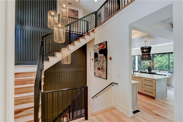 2207 W 71st St, Prairie Village, KS 66208 - stairway featuring wood finished floors and baseboards