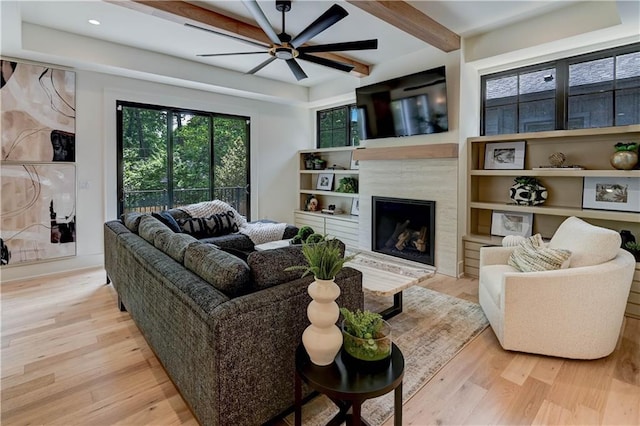 2207 W 71st St, Prairie Village, KS 66208 - living room featuring wood finished floors, a ceiling fan, beamed ceiling, a premium fireplace, and recessed lighting