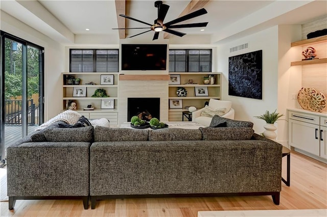 2207 W 71st St, Prairie Village, KS 66208 - living room with a ceiling fan, light wood-type flooring, a premium fireplace, and recessed lighting