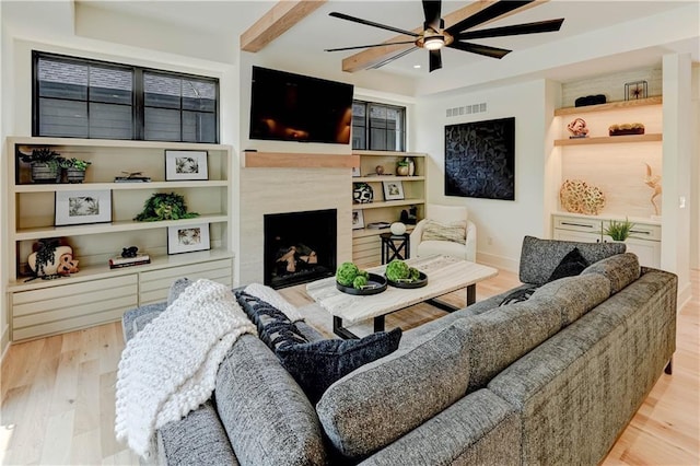 2207 W 71st St, Prairie Village, KS 66208 - living area featuring ceiling fan, wood finished floors, a high end fireplace, recessed lighting, and baseboards