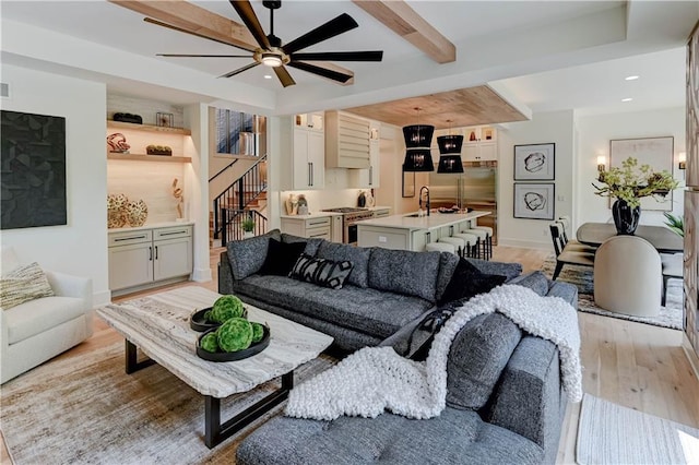 2207 W 71st St, Prairie Village, KS 66208 - living room with light wood-type flooring, ceiling fan, stairs, and recessed lighting