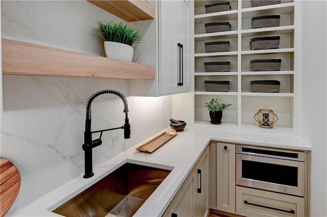 2207 W 71st St, Prairie Village, KS 66208 - kitchen view of a sink, open shelves, and oven