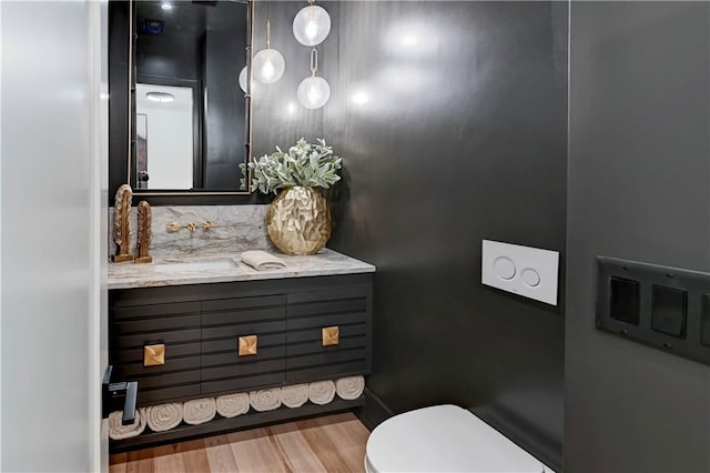 2207 W 71st St, Prairie Village, KS 66208 - bathroom with vanity, wood finished floors, and toilet