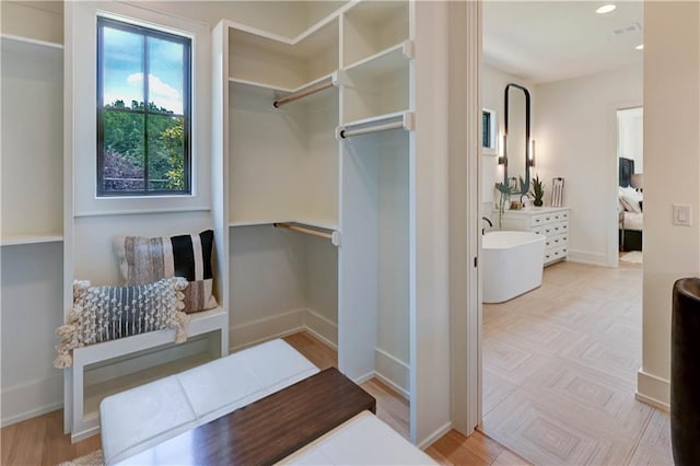 2207 W 71st St, Prairie Village, KS 66208 - spacious closet featuring wood finished floors