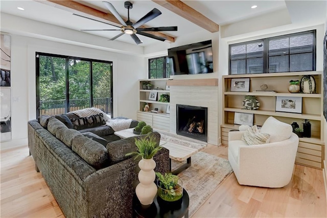 2207 W 71st St, Prairie Village, KS 66208 - living room featuring wood finished floors, ceiling fan, beamed ceiling, a fireplace, and recessed lighting