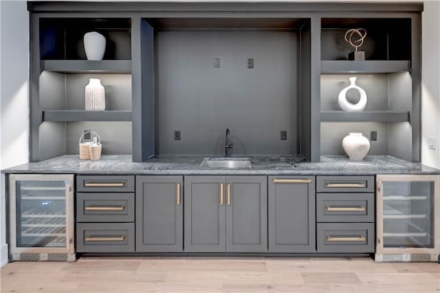2207 W 71st St, Prairie Village, KS 66208 - indoor wet bar featuring beverage cooler and light wood-style flooring
