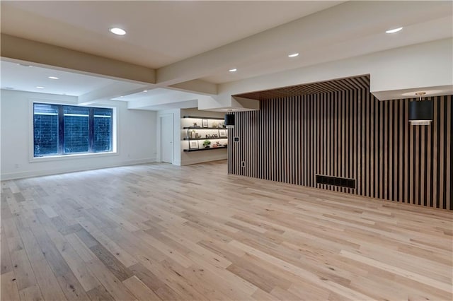 2207 W 71st St, Prairie Village, KS 66208 - unfurnished living room featuring wood finished floors, beam ceiling, baseboards, and recessed lighting