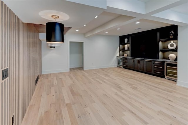 2207 W 71st St, Prairie Village, KS 66208 - unfurnished living room featuring beverage cooler, light wood finished floors, baseboards, recessed lighting, and beamed ceiling