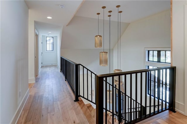 2207 W 71st St, Prairie Village, KS 66208 - hall featuring an upstairs landing, wood finished floors, recessed lighting, baseboards, and lofted ceiling