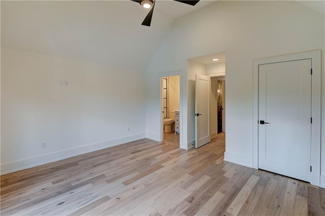 2207 W 71st St, Prairie Village, KS 66208 - unfurnished bedroom with baseboards, light wood-style floors, ensuite bath, a ceiling fan, and high vaulted ceiling