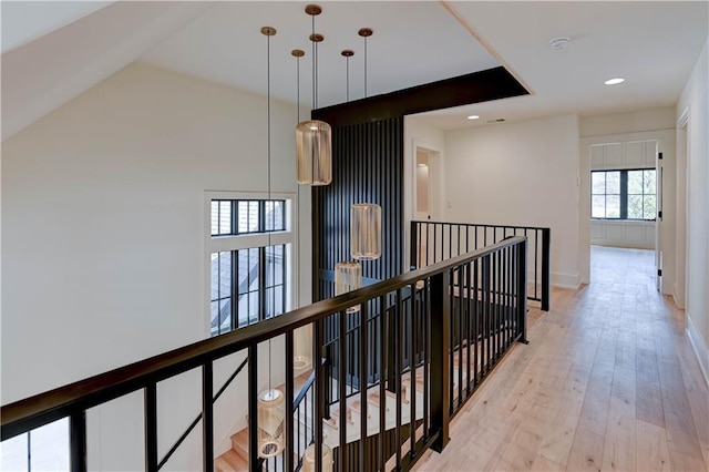 2207 W 71st St, Prairie Village, KS 66208 - hall with an upstairs landing, recessed lighting, light wood-style floors, and baseboards