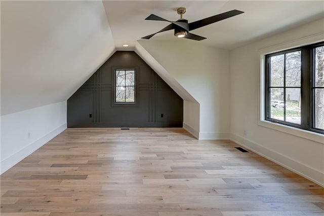 2207 W 71st St, Prairie Village, KS 66208 - bonus room featuring a ceiling fan, lofted ceiling, baseboards, and light wood-style flooring