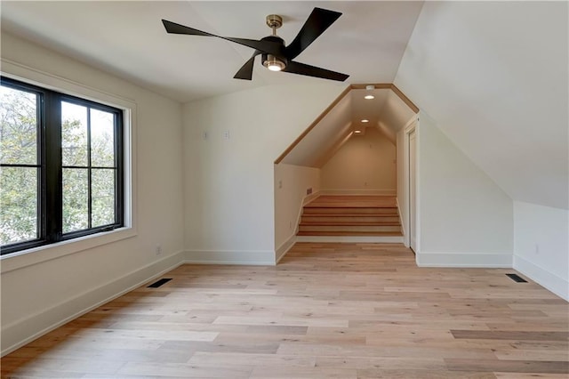 2207 W 71st St, Prairie Village, KS 66208 - additional living space with vaulted ceiling, light wood-type flooring, baseboards, and ceiling fan