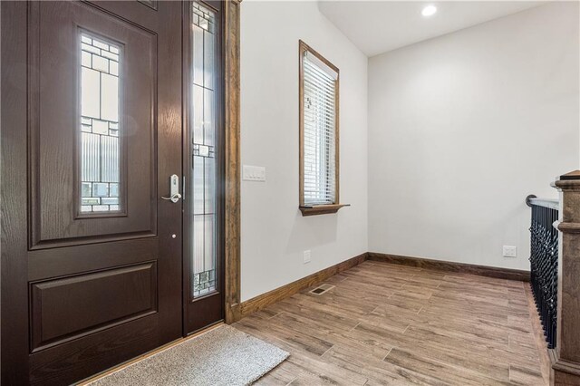 entryway featuring a healthy amount of sunlight and light hardwood / wood-style floors