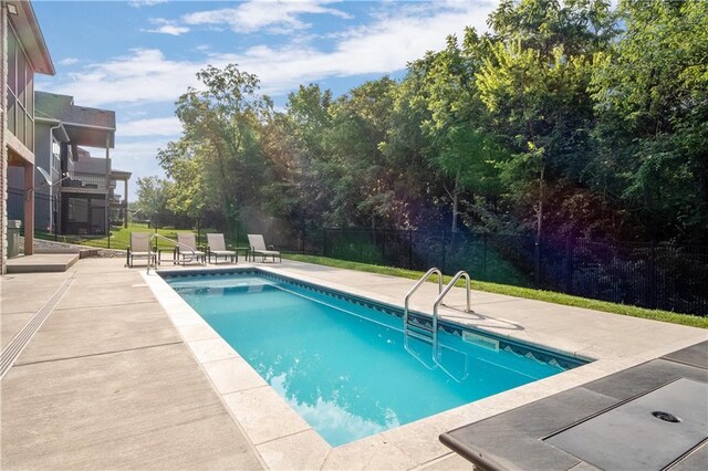 view of swimming pool with a patio