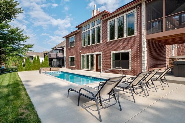 view of pool featuring a patio area