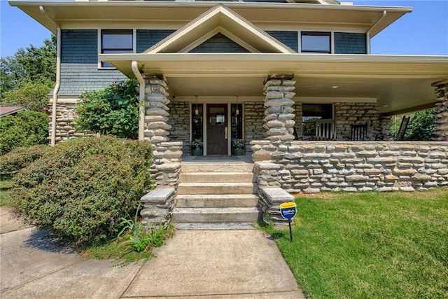 doorway to property with covered porch