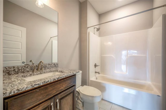 full bathroom with shower / bath combination, tile patterned floors, toilet, and vanity