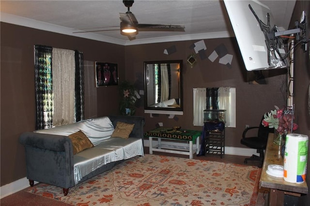 living room with crown molding, ceiling fan, and hardwood / wood-style floors