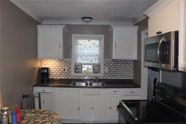 kitchen with white cabinets, decorative backsplash, sink, and black range with electric cooktop